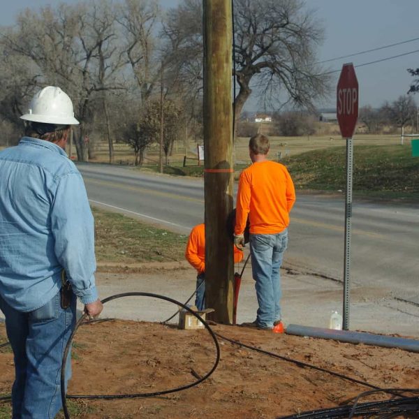 USA Construction Co. employees are placing a new cable under Highway 58 as part of our Fiber Optic Network expansion to the north side of the Washita River. Pictured are Tony Roseberry and Grady Peters. (from l-r)